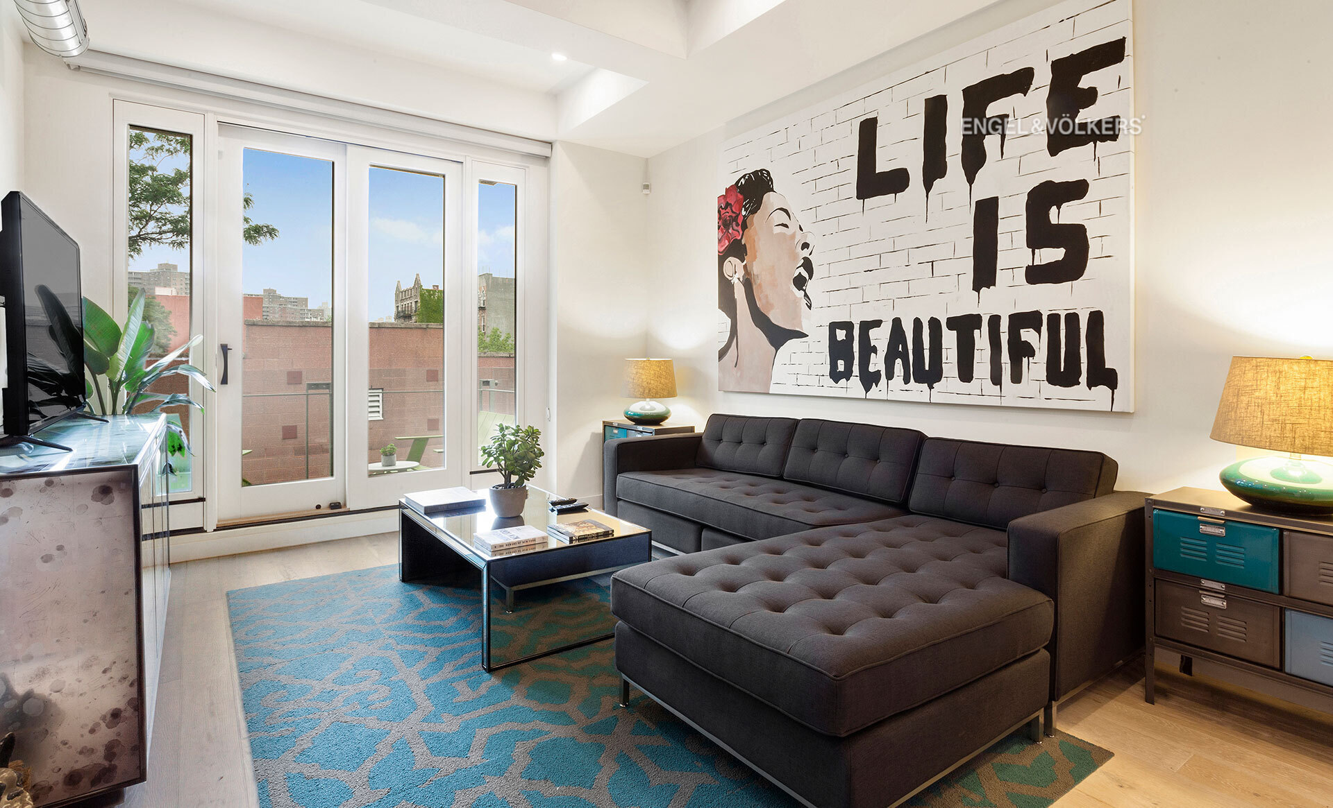 a living room with furniture and a flat screen tv