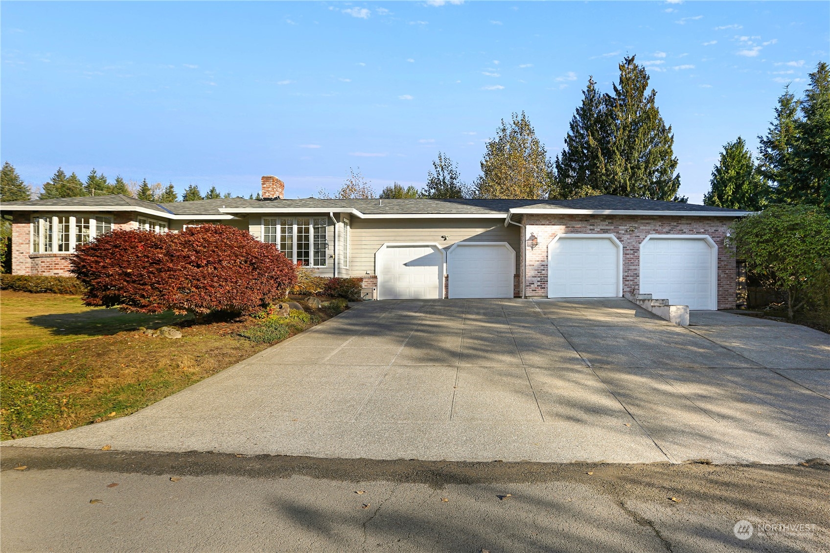 15203 Southeast 132nd Street Renton, WA 98059 - Photo 1 of 35 a front view of a house with a garden
