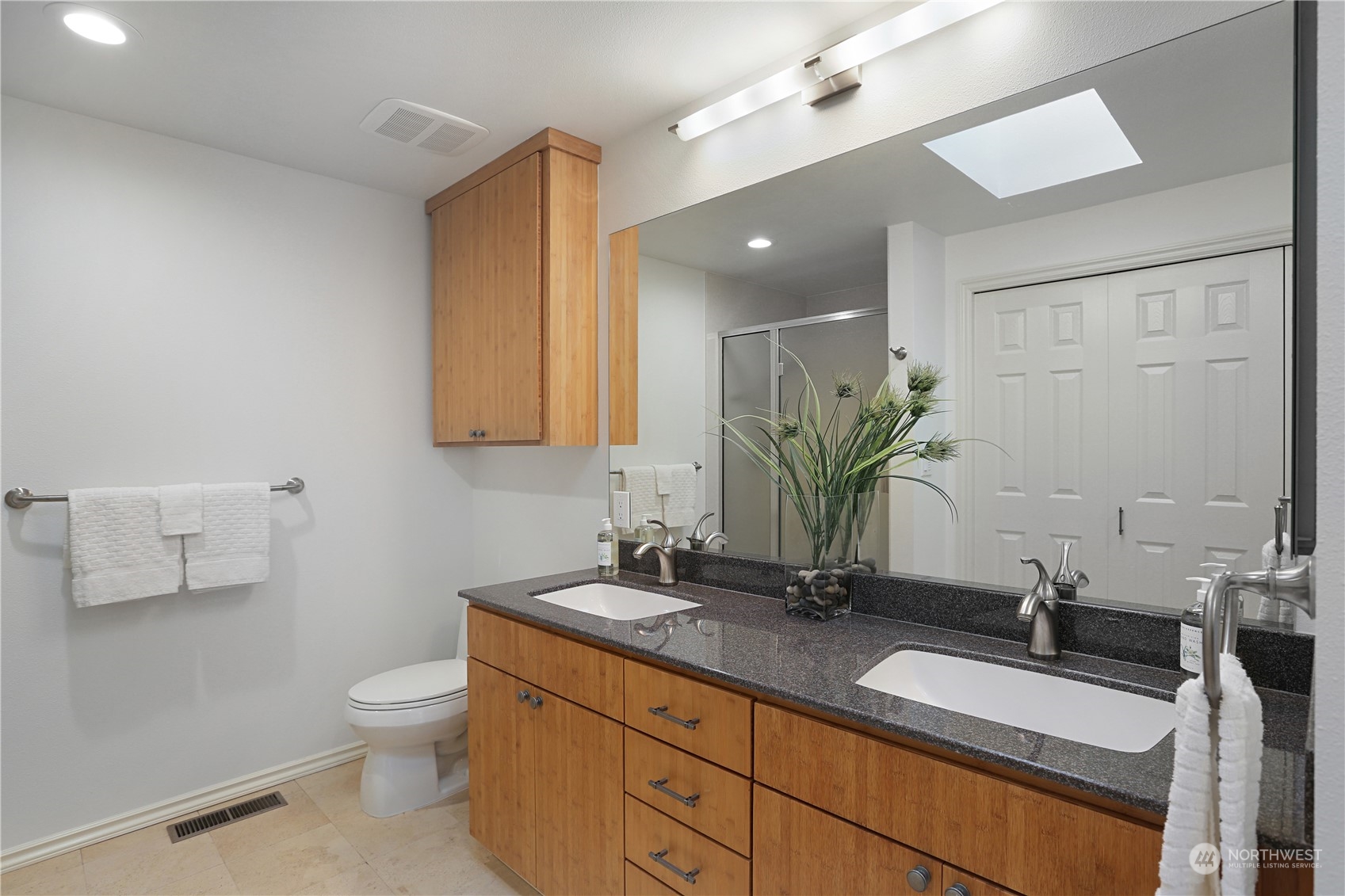 15203 Southeast 132nd Street Renton, WA 98059 - Photo 20 of 35 a bathroom with a granite countertop sink and a mirror