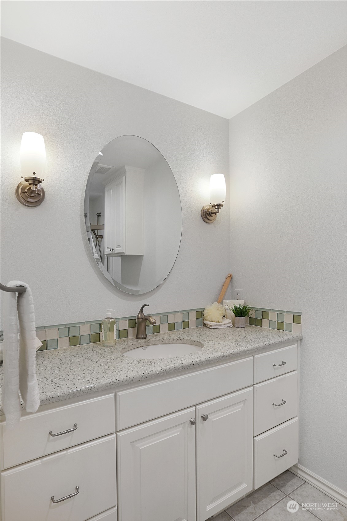 15203 Southeast 132nd Street Renton, WA 98059 - Photo 23 of 35 a bathroom with a granite countertop double vanity and mirror
