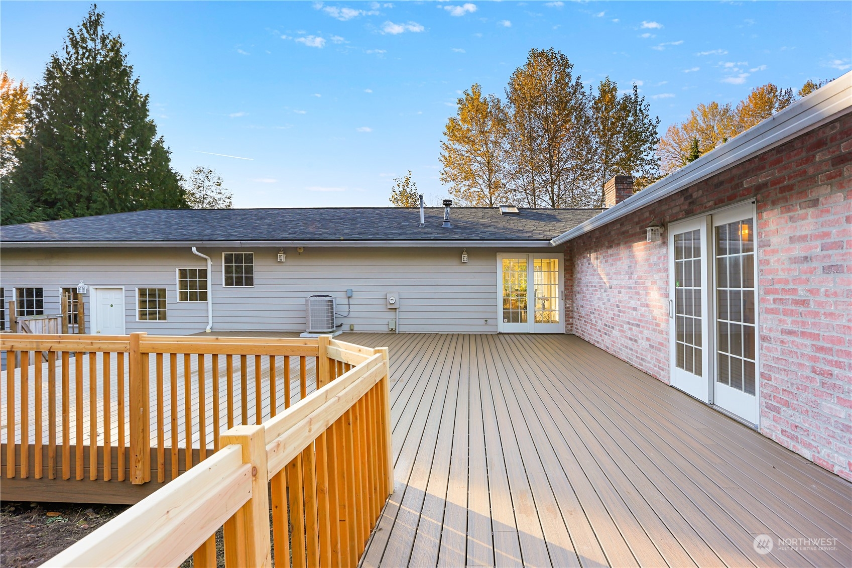 15203 Southeast 132nd Street Renton, WA 98059 - Photo 24 of 35 a view of backyard with deck and wooden floor