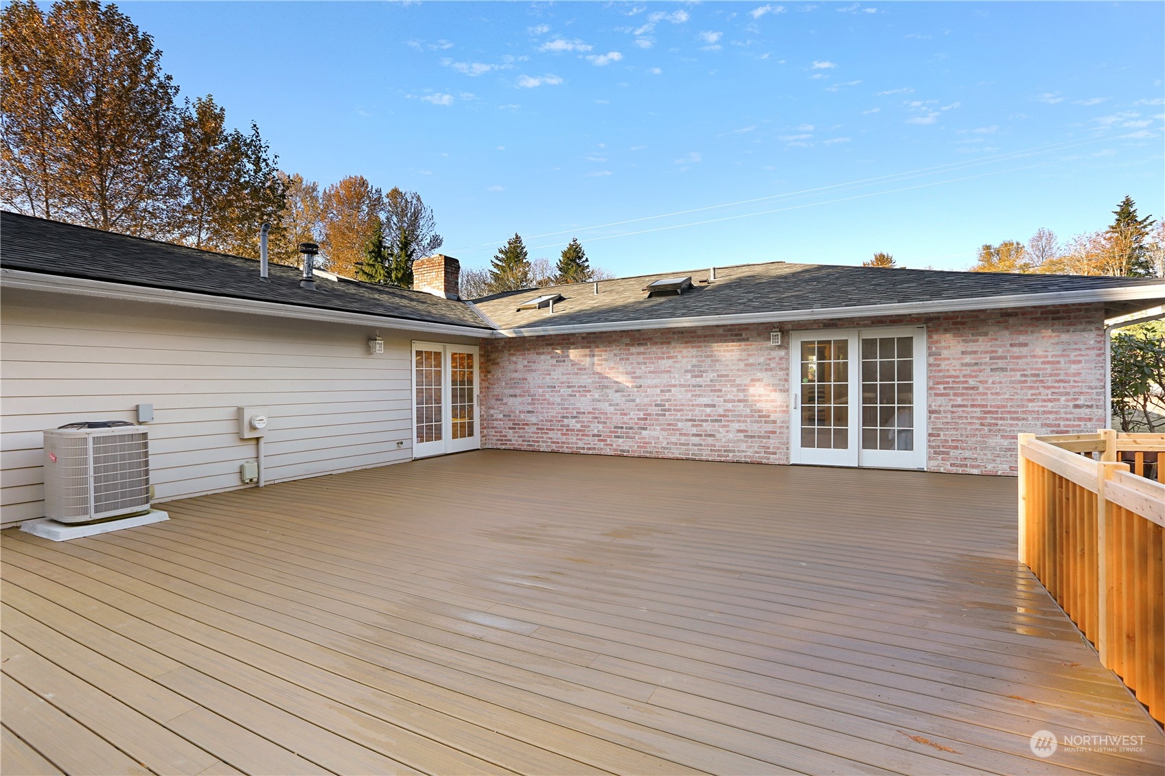 15203 Southeast 132nd Street Renton, WA 98059 - Photo 25 of 35 a view of a house with a roof deck