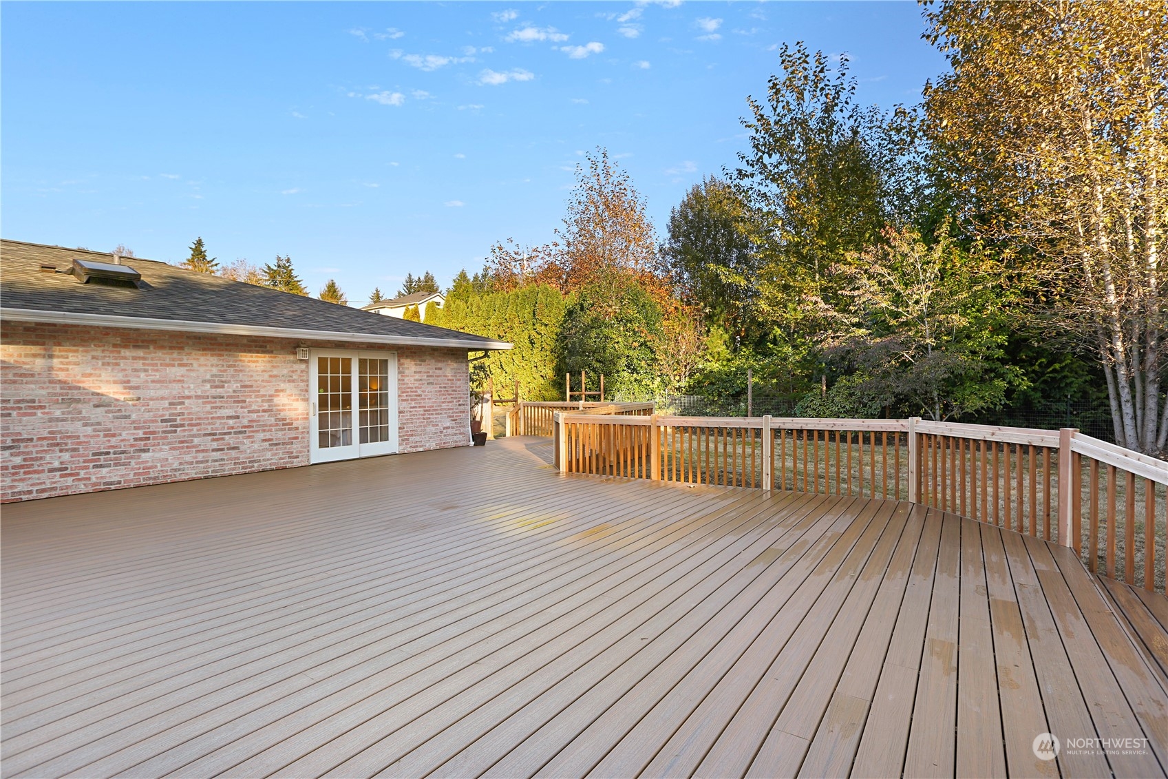 15203 Southeast 132nd Street Renton, WA 98059 - Photo 26 of 35 a view of a balcony with wooden floor and iron fence