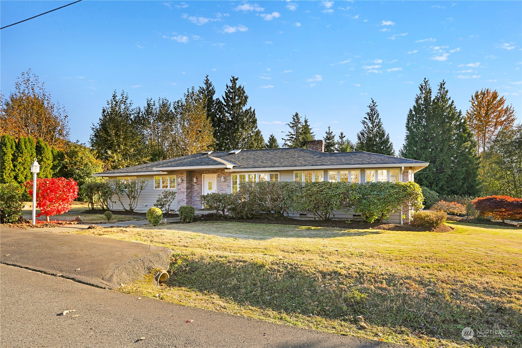 15203 Southeast 132nd Street Renton, WA 98059 - Photo 3 of 35 a view of a house with outdoor space and sitting area