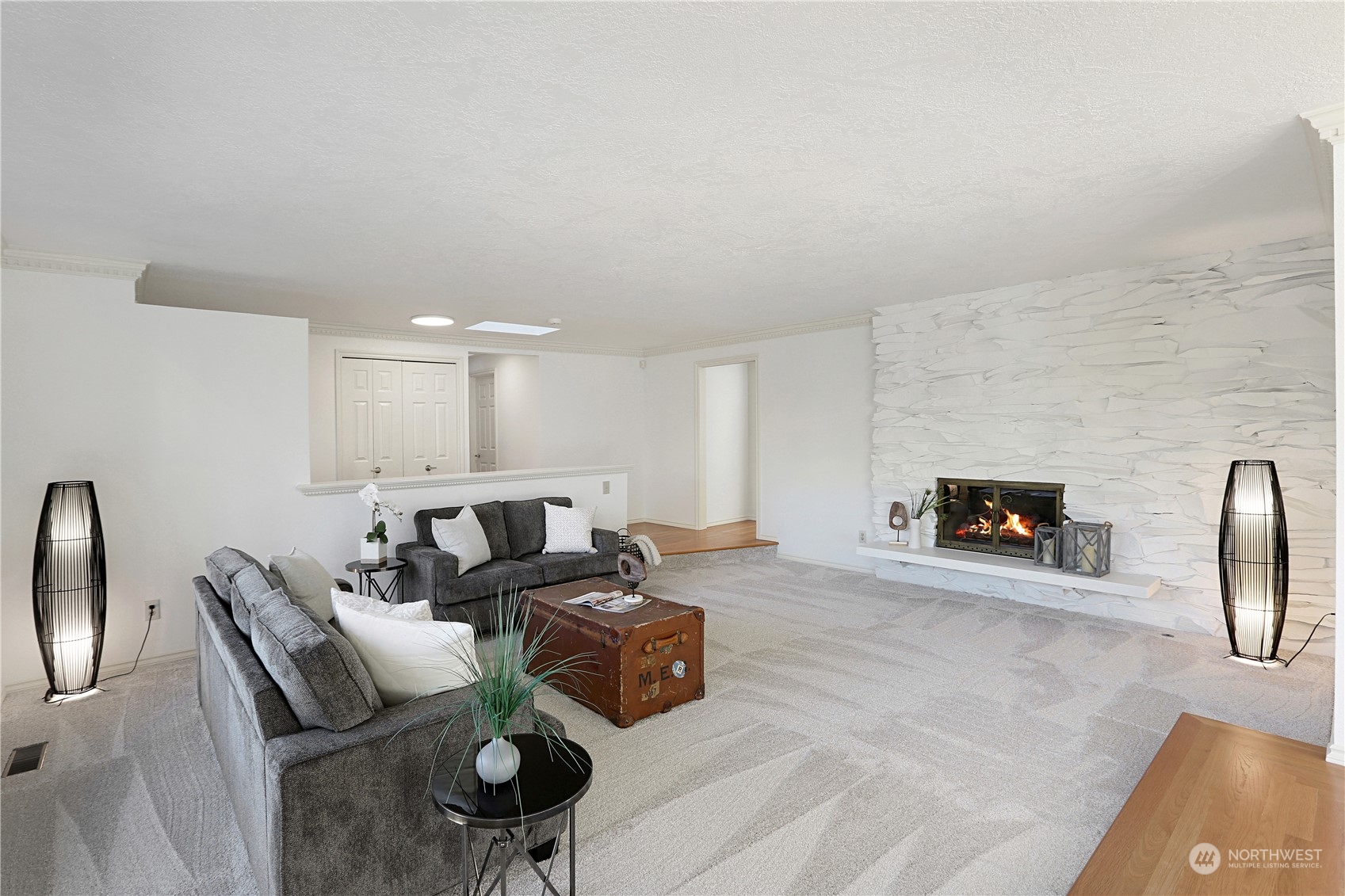 15203 Southeast 132nd Street Renton, WA 98059 - Photo 8 of 35 a living room with furniture and a fireplace