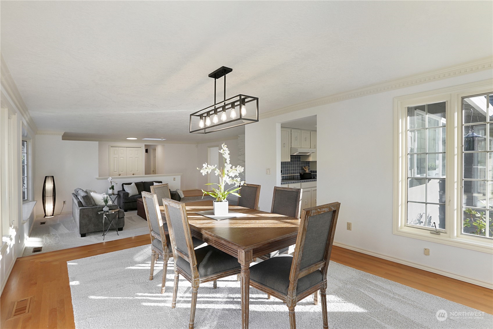 15203 Southeast 132nd Street Renton, WA 98059 - Photo 10 of 35 a view of a dining room with furniture window and wooden floor