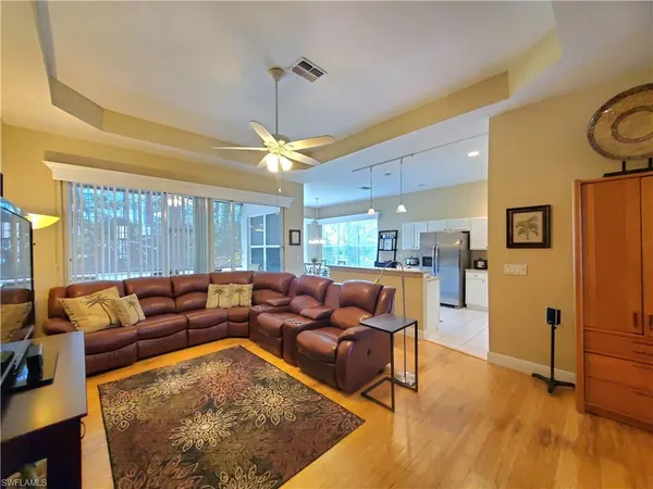 a bedroom with a large bed and a couch