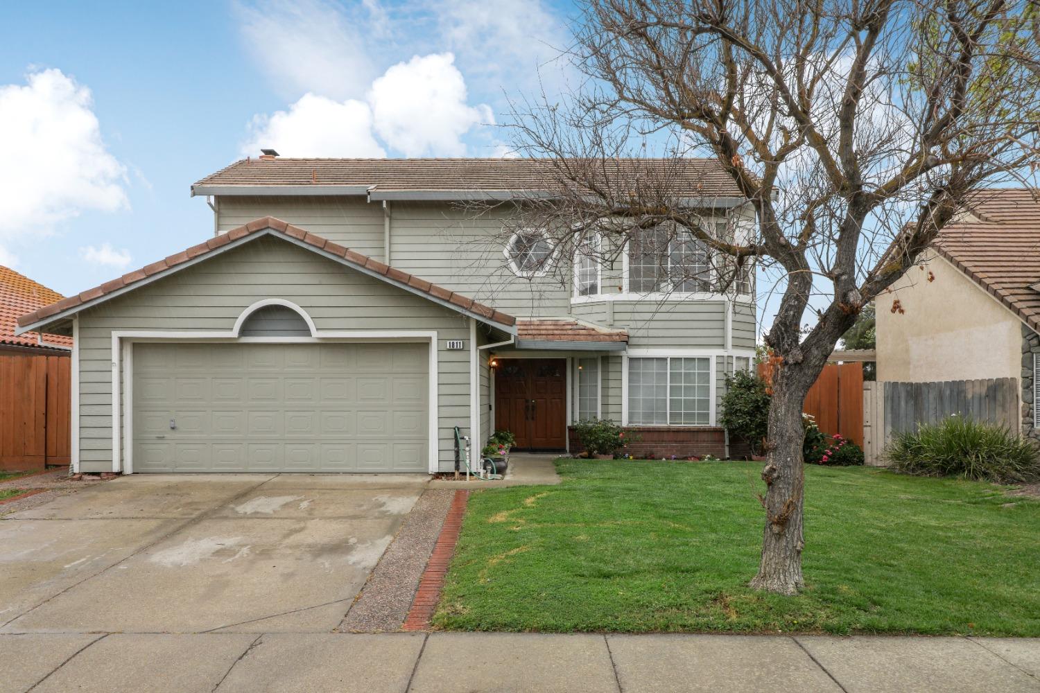 1811 Summertime Drive Tracy, CA 95376 - Photo 1 of 1 a front view of house with yard