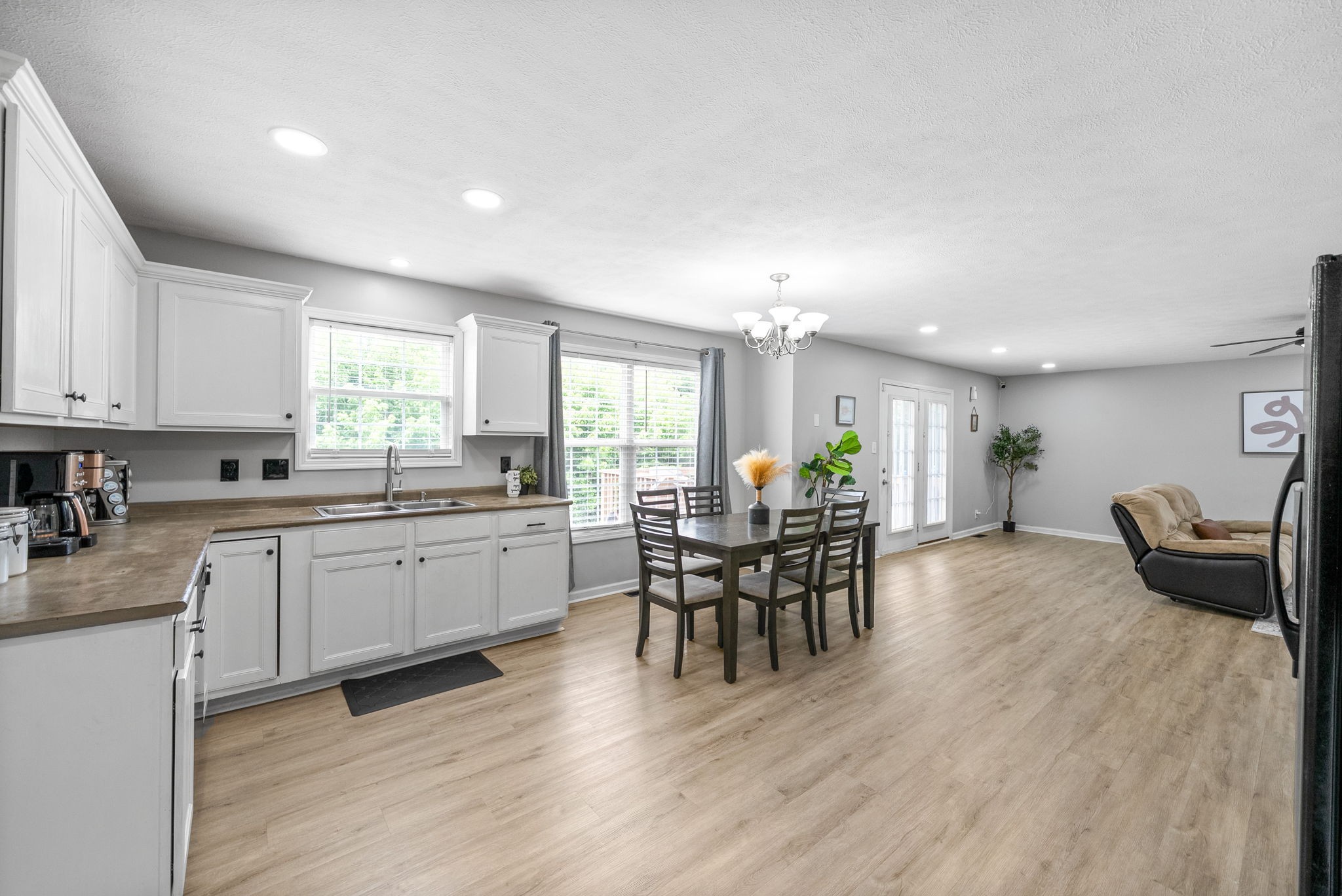 1556 Apache Way Clarksville, TN 37042 - Photo 11 of 24 a kitchen with furniture and wooden floor