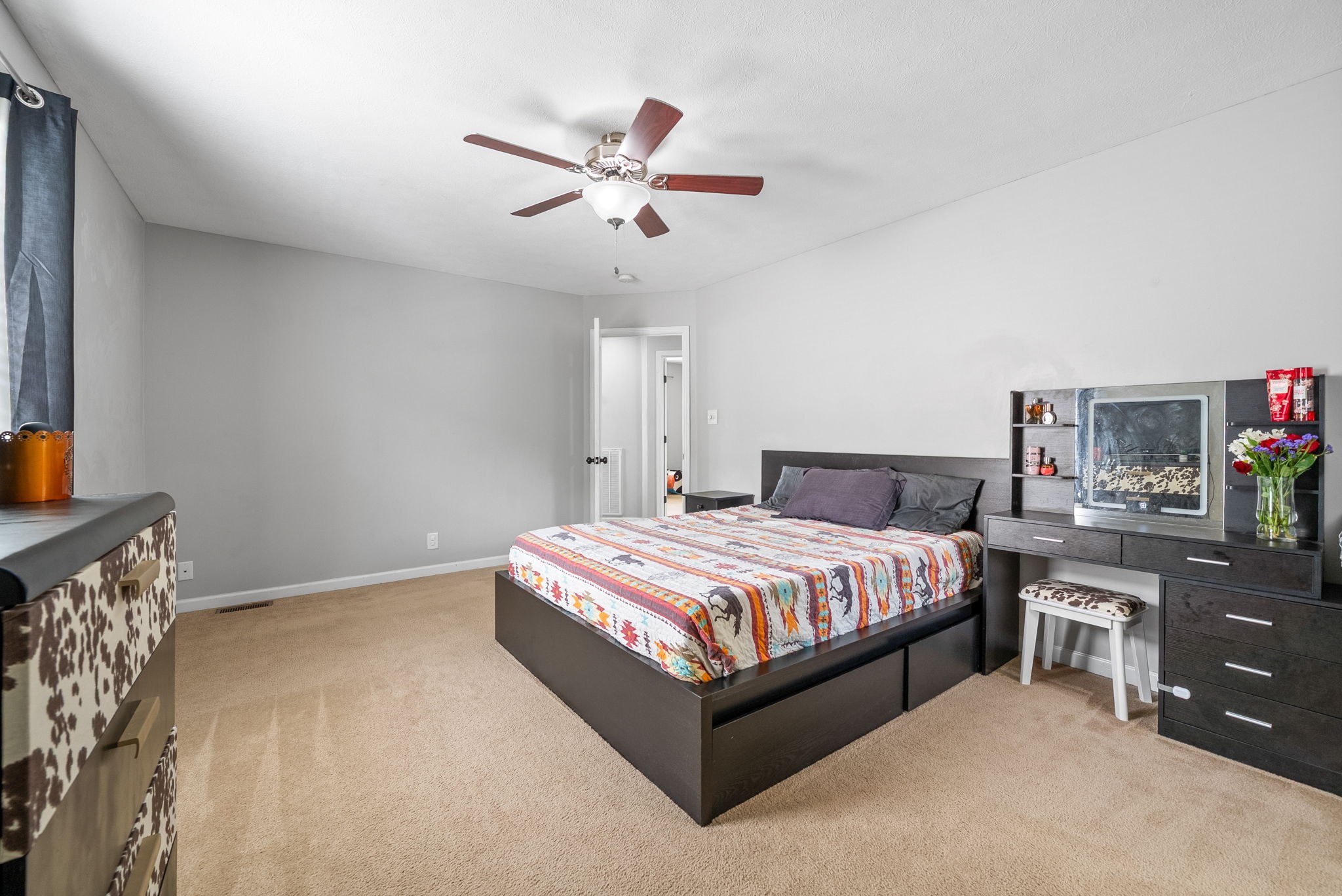 1556 Apache Way Clarksville, TN 37042 - Photo 19 of 24 a spacious bedroom with a bed and dresser