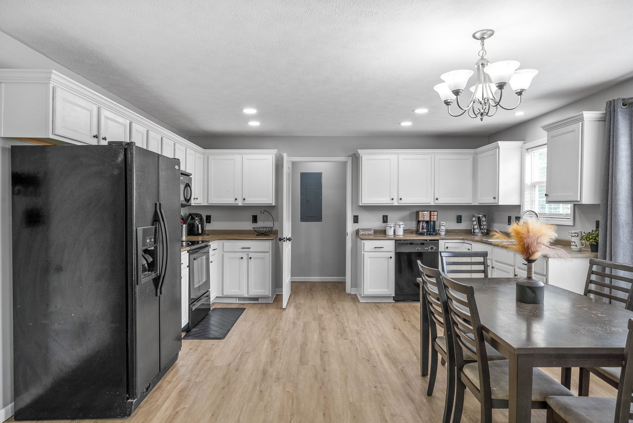 1556 Apache Way Clarksville, TN 37042 - Photo 9 of 24 a kitchen with refrigerator a stove and cabinets