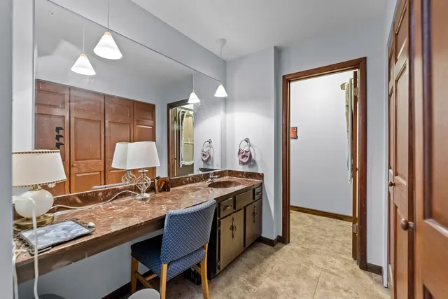 a view of a workspace with furniture