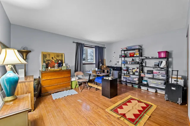 a living room with furniture a rug and a wooden floor