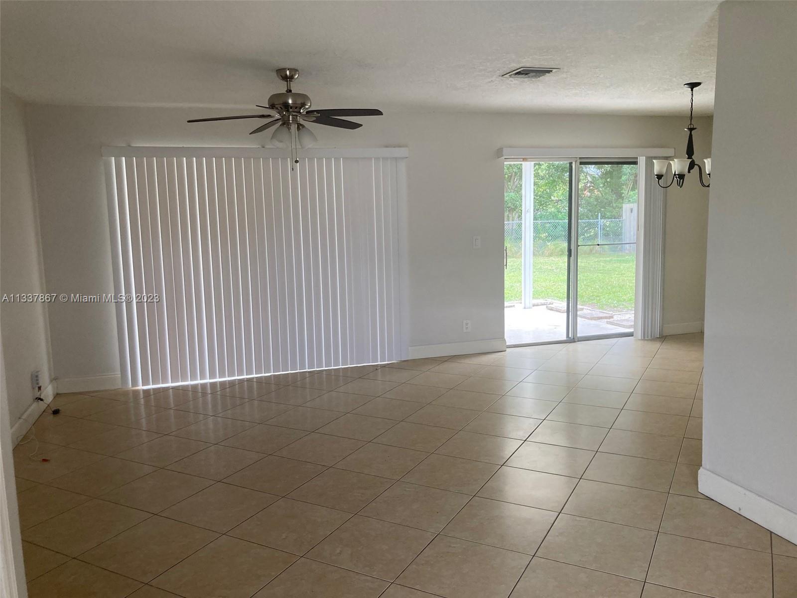 10374 Sleepy Brook Way Boca Raton, FL 33428 - Photo 12 of 12 a view of an empty room and a window