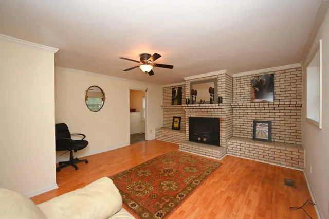 a living room with furniture and a fireplace