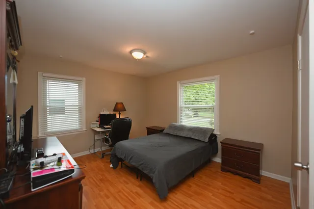 a bed room with a bed and a window