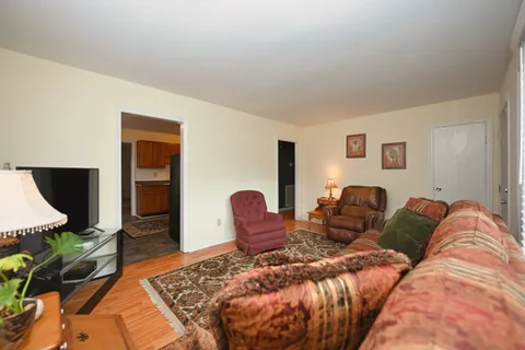 a bed room with a bed and a television