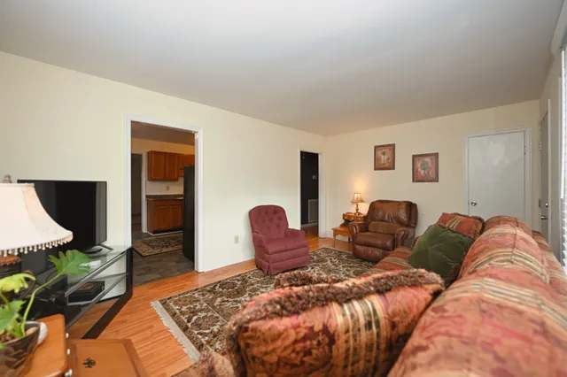 a bed room with a bed and a television