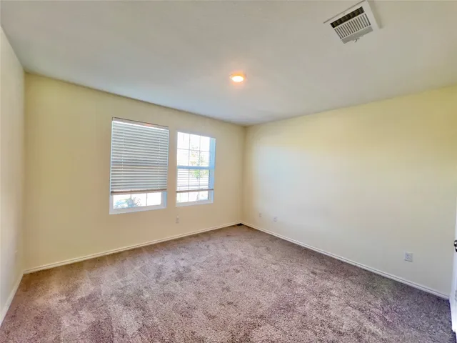 a bathroom with a sink a toilet a mirror and bathtub