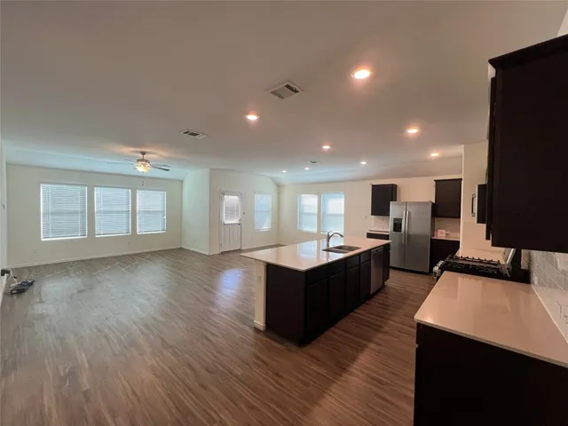 an empty room with a empty space and windows