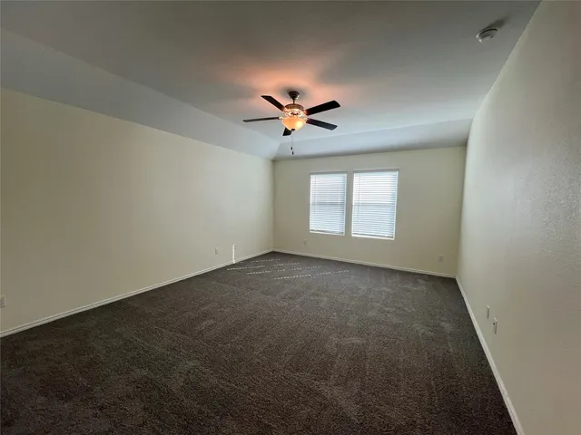 a large kitchen with kitchen island wooden floors and stainless steel appliances