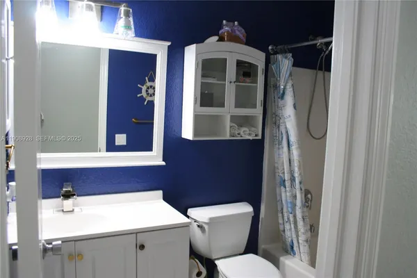 a bathroom with a toilet and a sink