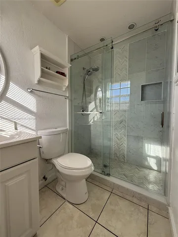 a bedroom with furniture and window