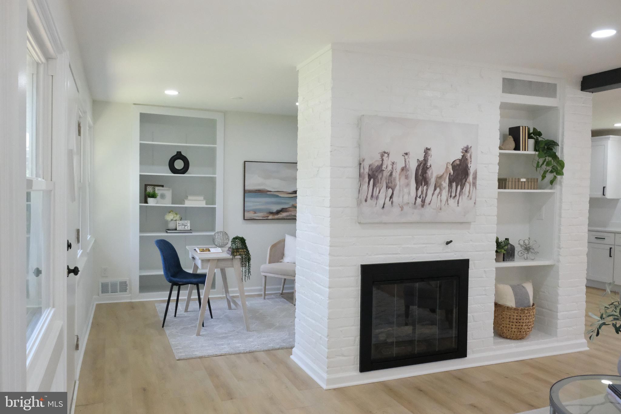 1825 Tilton Drive Silver Spring, MD 20902 - Photo 11 of 31 a living room with furniture and a fireplace