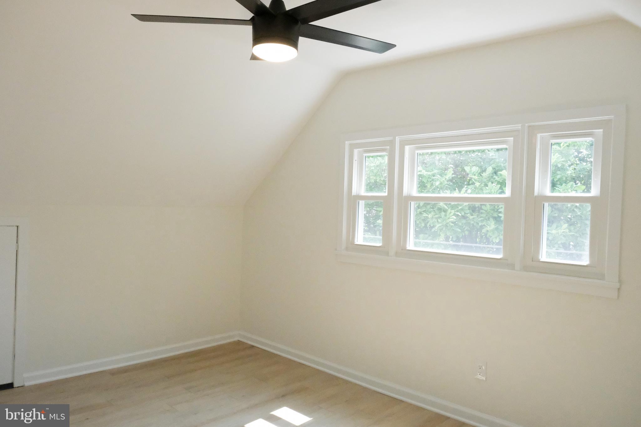 1825 Tilton Drive Silver Spring, MD 20902 - Photo 19 of 31 an empty room with a window and a fan