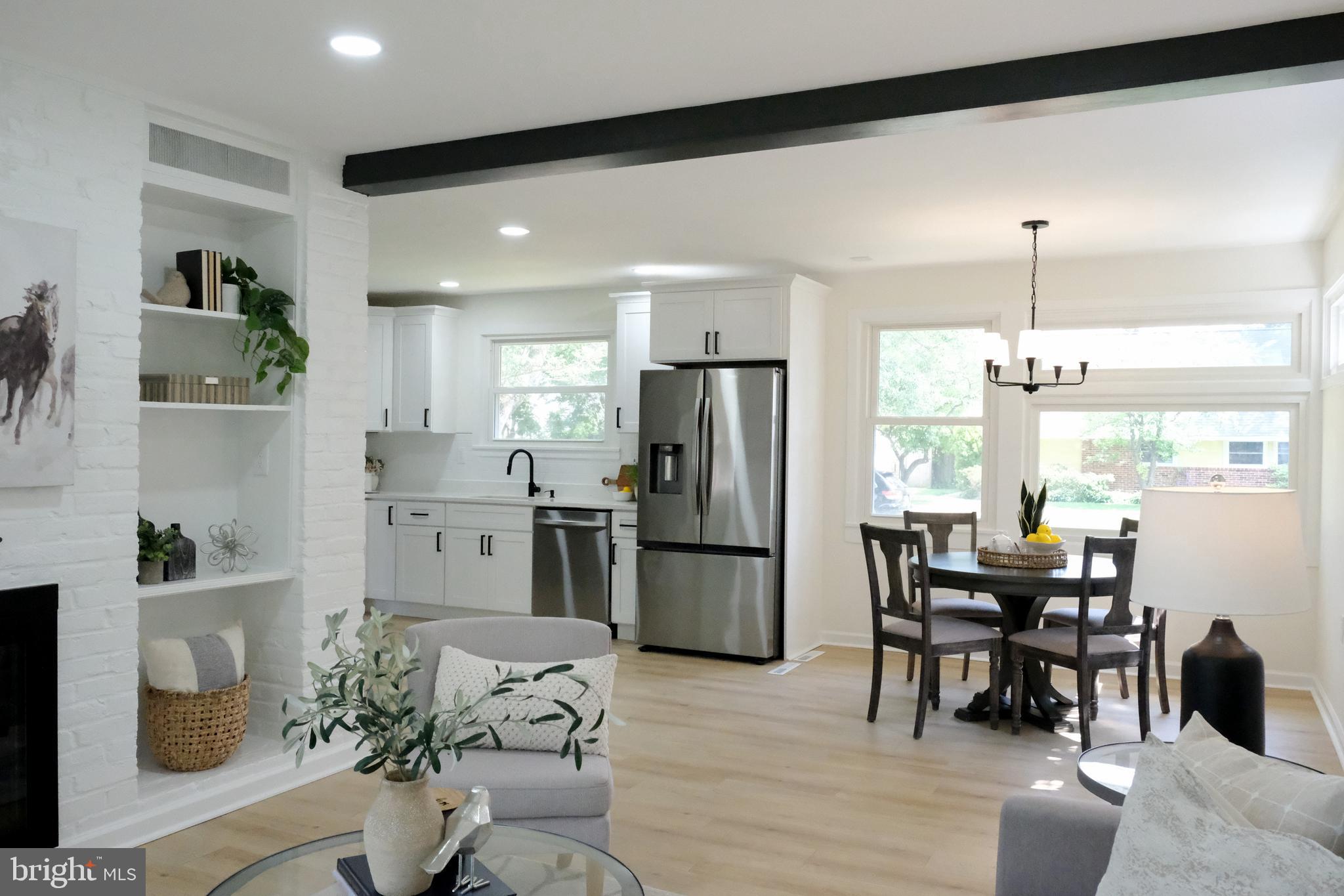 1825 Tilton Drive Silver Spring, MD 20902 - Photo 2 of 31 a kitchen with a table and chairs in it