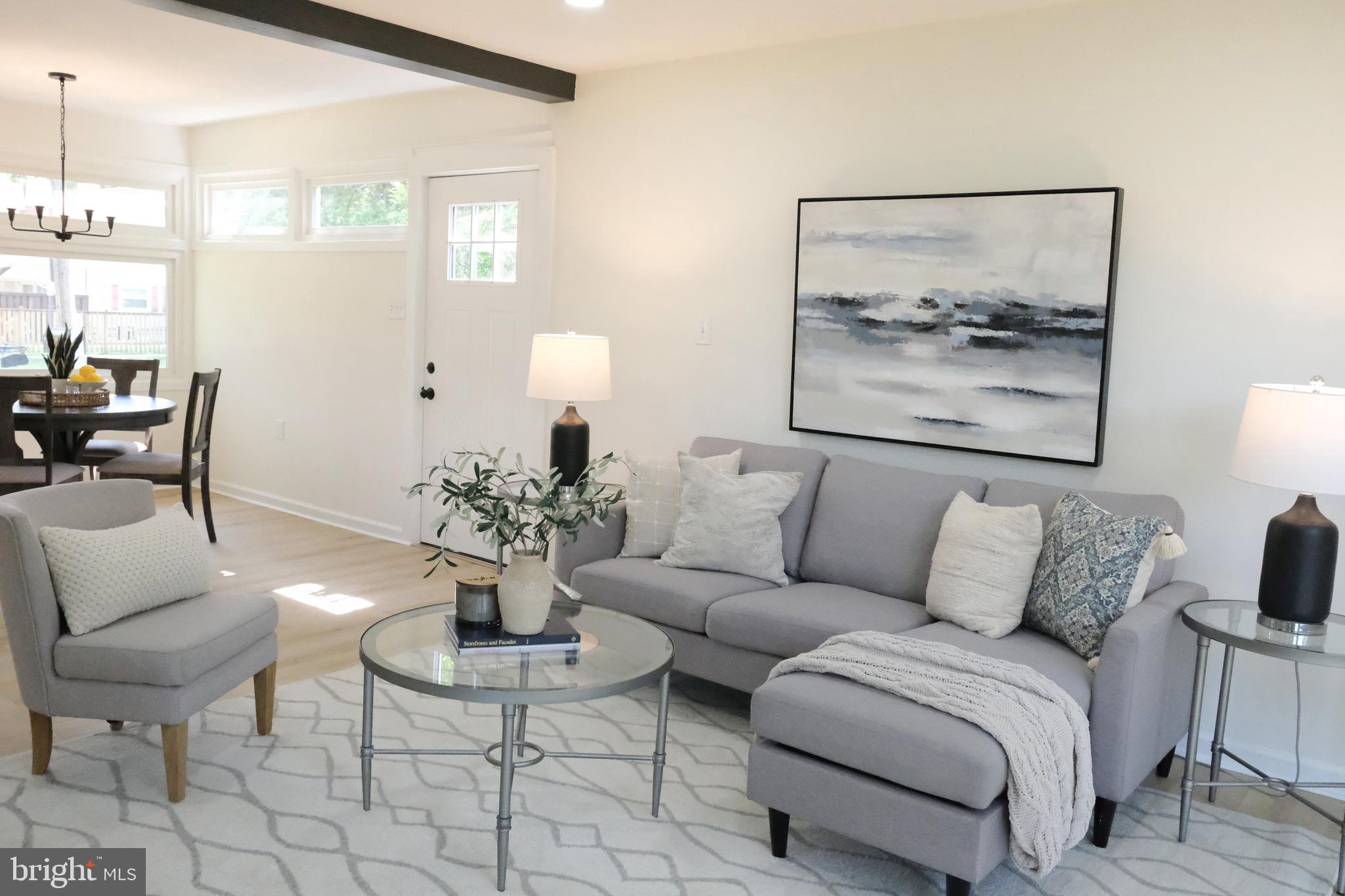 1825 Tilton Drive Silver Spring, MD 20902 - Photo 3 of 31 a living room with furniture and a painting