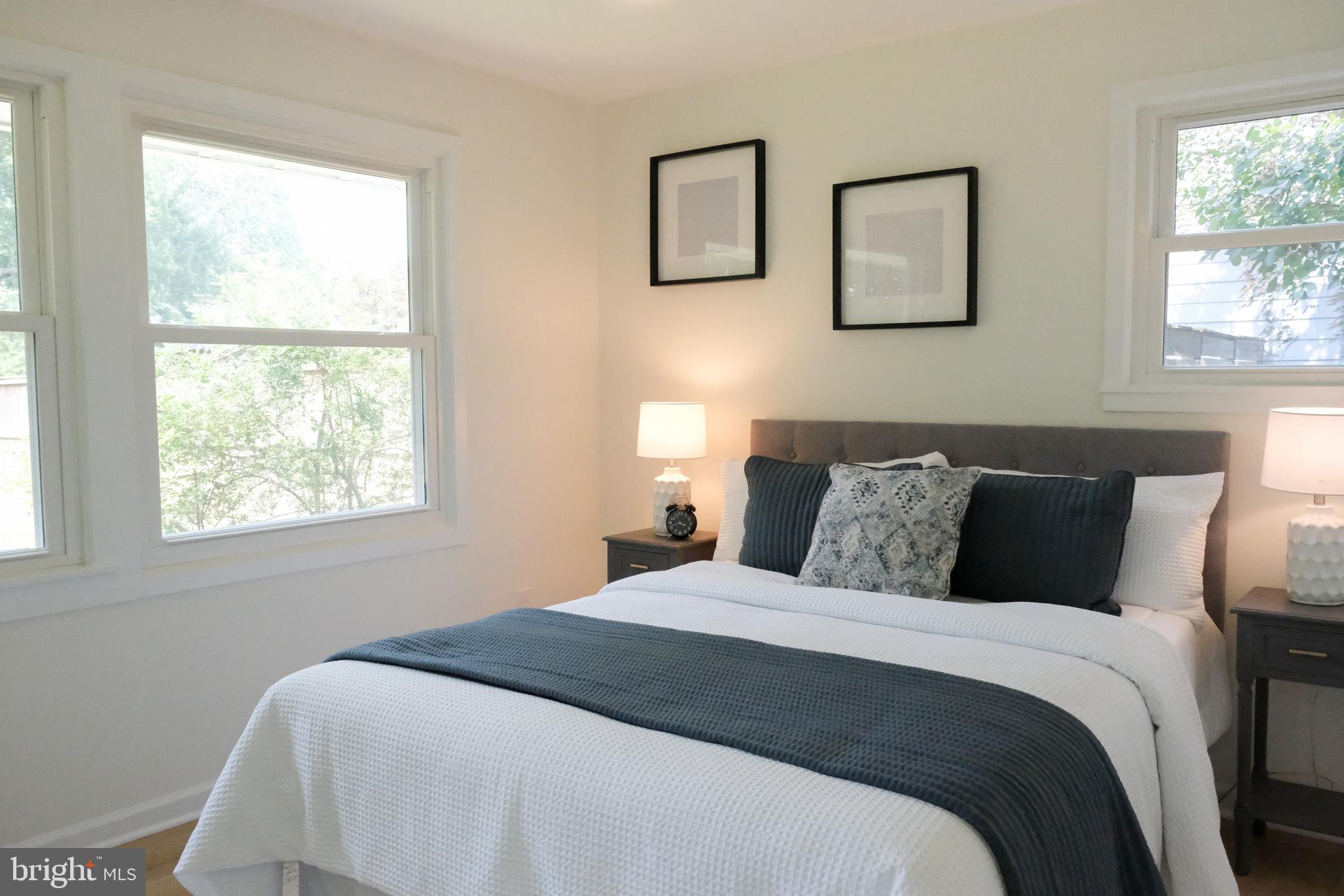 1825 Tilton Drive Silver Spring, MD 20902 - Photo 7 of 31 a bedroom with a bed and a window