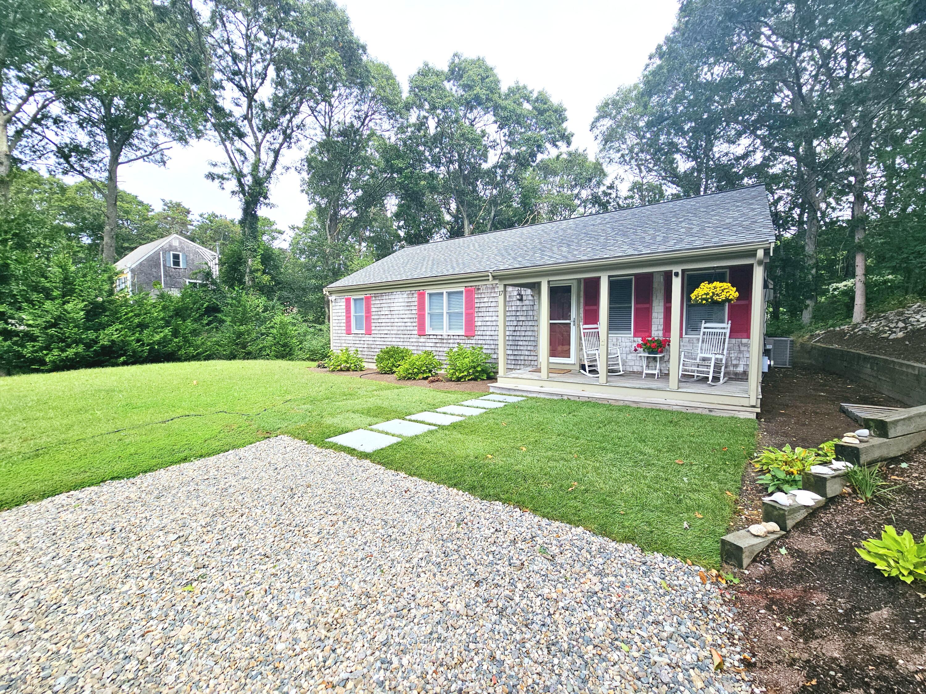 17 Valley Road Mashpee, MA 02649 - Photo 1 of 19 a front view of house with yard and green space
