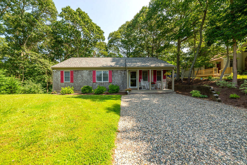 17 Valley Road Mashpee, MA 02649 - Photo 16 of 19 a front view of a house with yard and green space