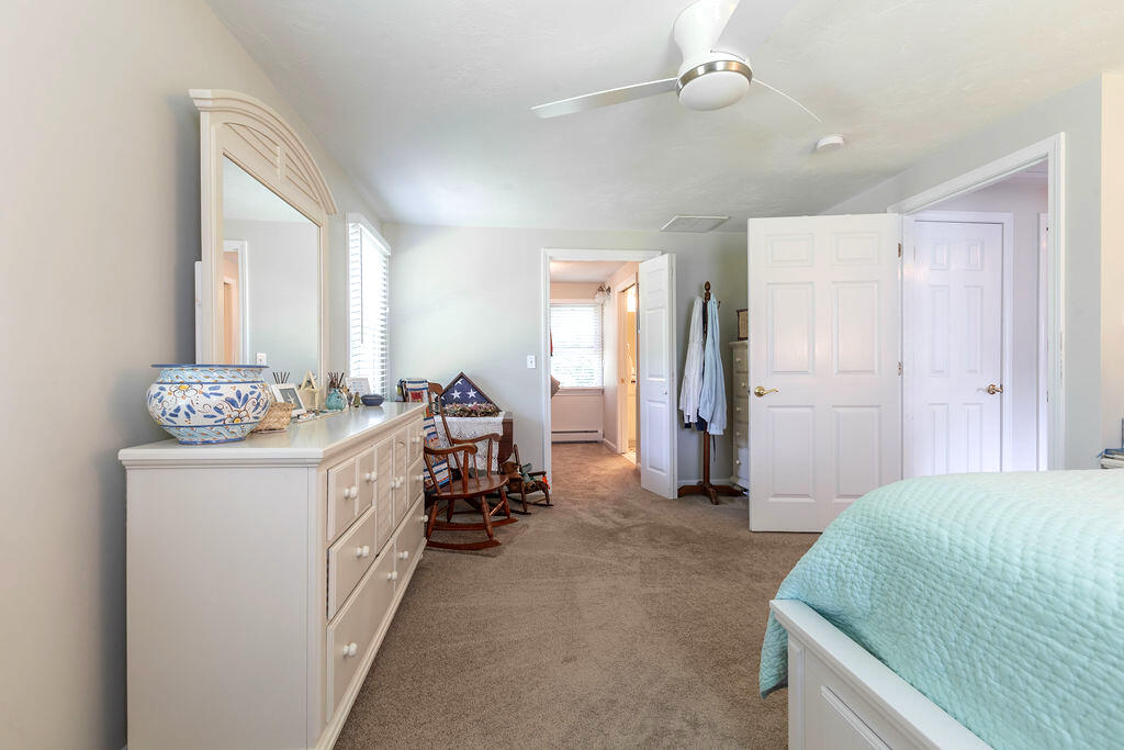 17 Valley Road Mashpee, MA 02649 - Photo 10 of 19 a room with a bed and a mirror