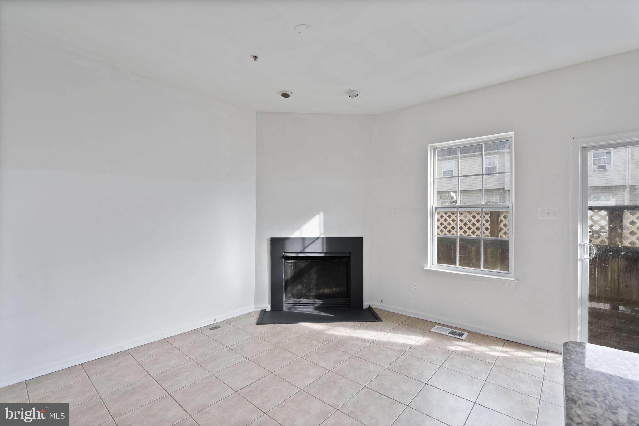 811 Middle River Road Baltimore, MD 21220 - Photo 17 of 55 an empty room with windows