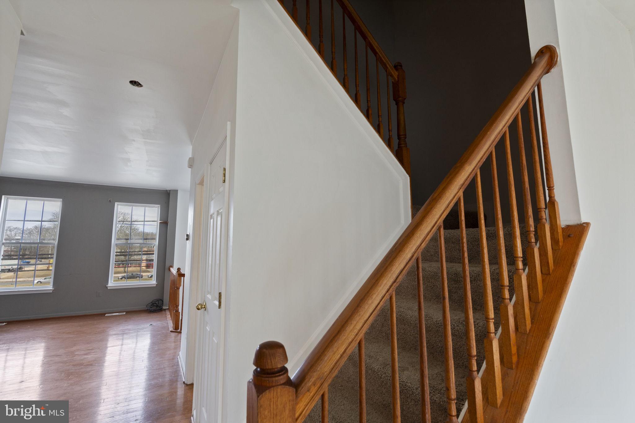 811 Middle River Road Baltimore, MD 21220 - Photo 19 of 55 a view of an entryway with wooden floor and stairs