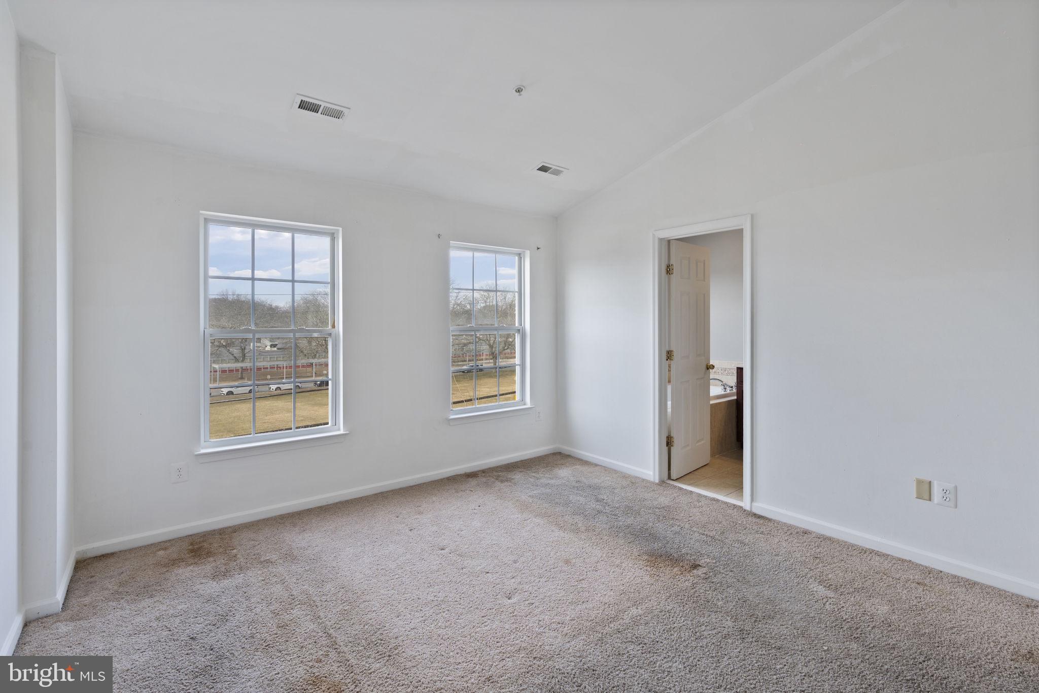 811 Middle River Road Baltimore, MD 21220 - Photo 21 of 55 a view of an empty room with windows