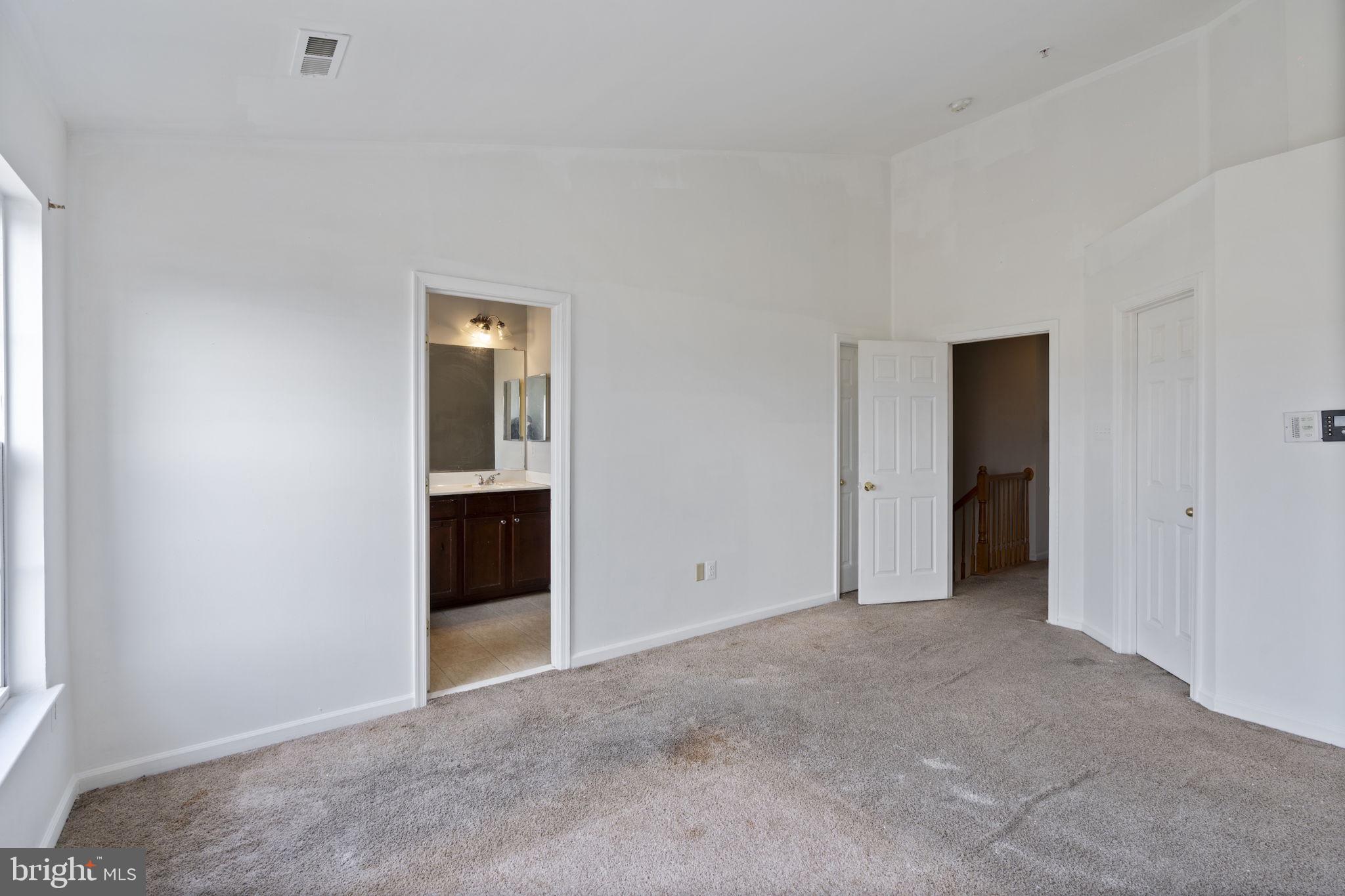 811 Middle River Road Baltimore, MD 21220 - Photo 22 of 55 a view of an empty room with a window