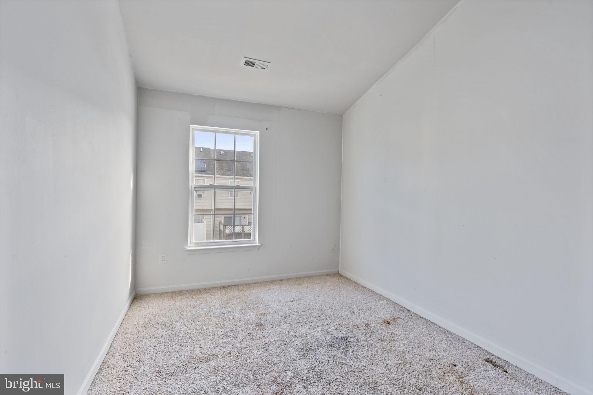 811 Middle River Road Baltimore, MD 21220 - Photo 29 of 55 an empty room with a window