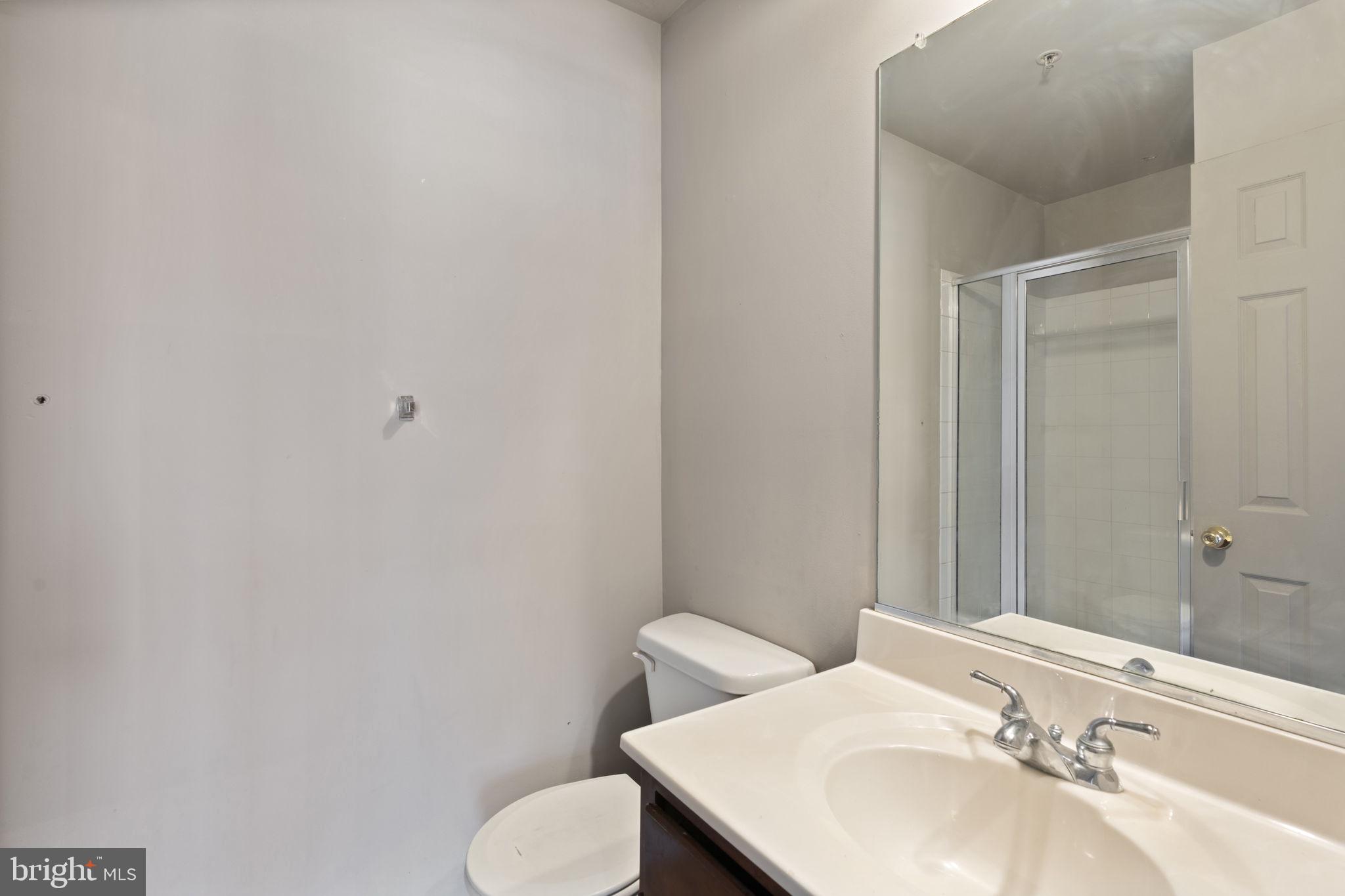 811 Middle River Road Baltimore, MD 21220 - Photo 37 of 55 a bathroom with a sink and a mirror