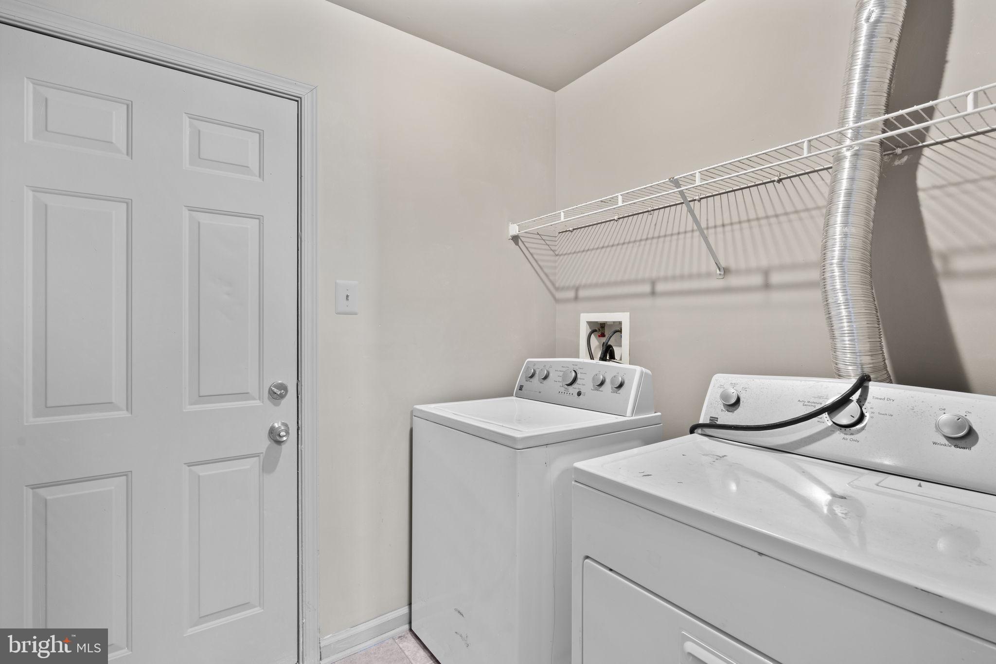 811 Middle River Road Baltimore, MD 21220 - Photo 39 of 55 a utility room with dryer and washer