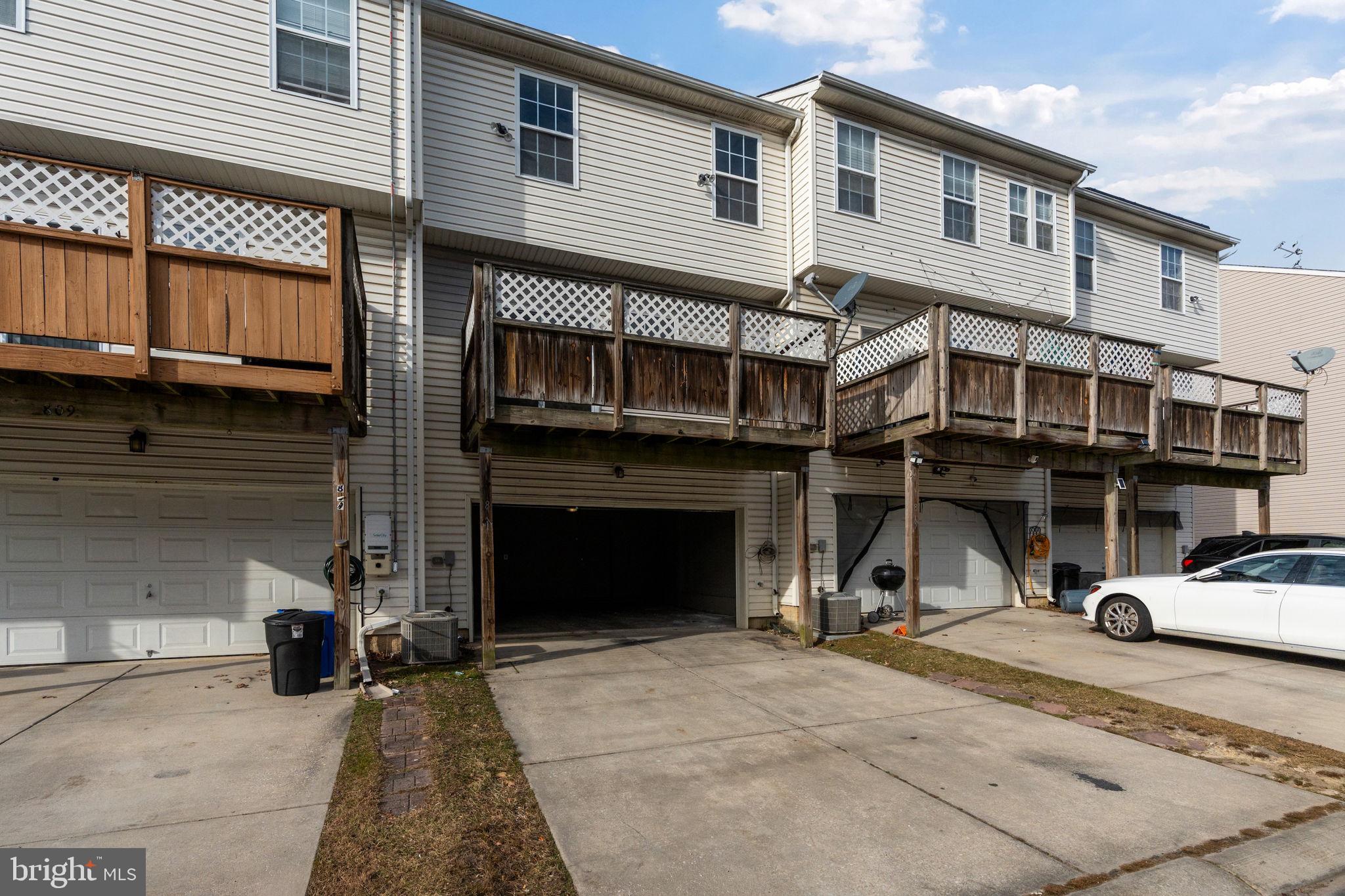 811 Middle River Road Baltimore, MD 21220 - Photo 47 of 55 a front view of a house with a car parked in front of it