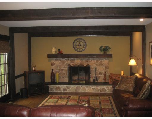 Den/Family/Great Room. ALL FURNITURE INCLUDED IN SALE!!! Wood burning stone fireplace, hardwood floors, see the deer in the private rear yard,