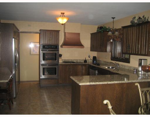 Kitchen. Granite counter tops,stainless steel dishwasher,refrigerator,double oven,microwave and jenn-air cook top all purchased in 2007