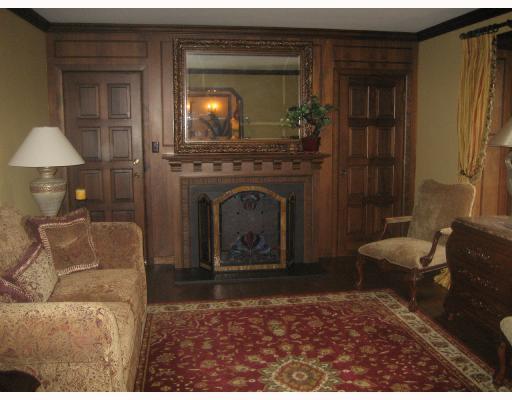 Living Room. ALL FURNITURE INCLUDED IN SALE!!! Door exits to covered side porch,hard wood floors,custom window treatments,leaded windows