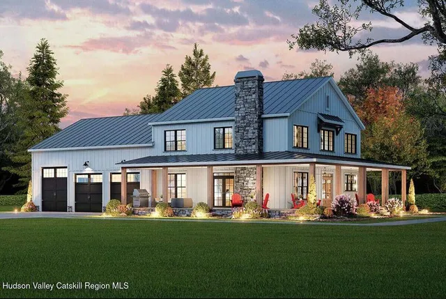 a front view of house with yard outdoor seating and green space