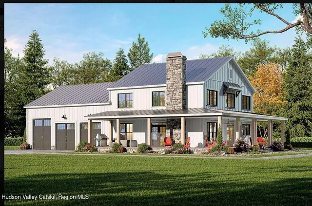 a front view of a residential apartment building with a yard