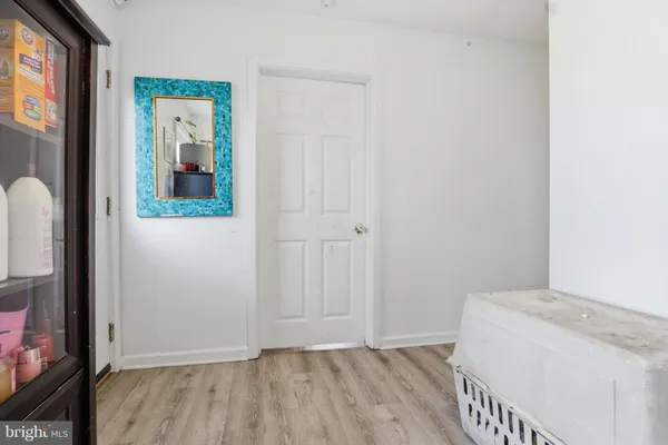 a view of hallway with wooden floor