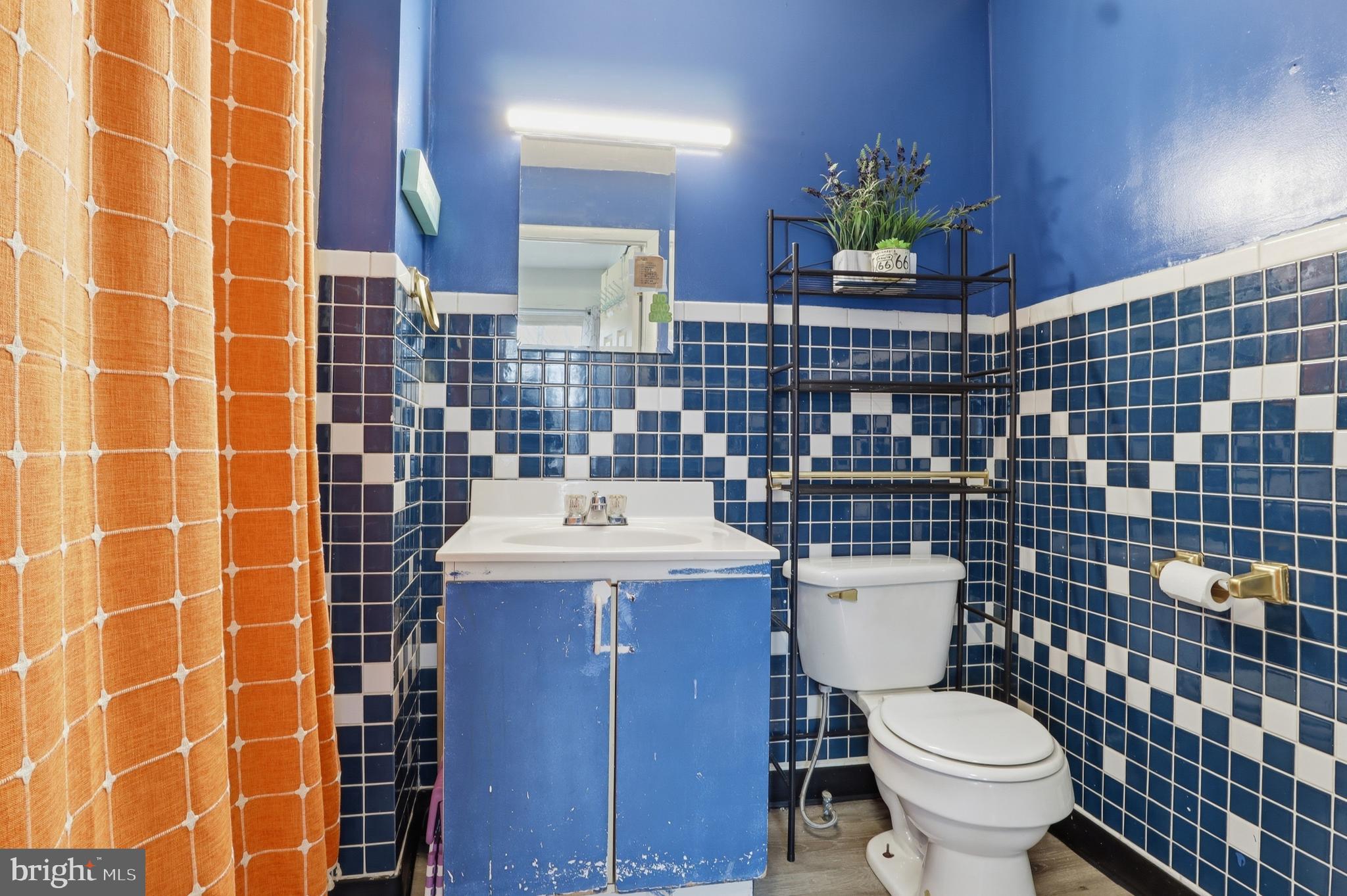 83 North Main Street Dover, PA 17315 - Photo 12 of 28 a bathroom with a sink a toilet and a shower